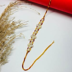Gracefully Woven Pearl Rakhi