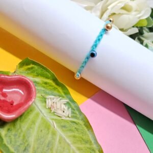Handmade Blue Rakhi with Gold Beads & Evil Eye Charm