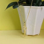 Curved AD Gold-Tone Drop Pendant