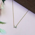Graceful CZ Gold-Tone Bow Pendant