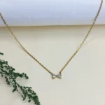 Graceful CZ Gold-Tone Bow Pendant