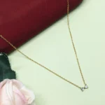 Graceful CZ Gold-Tone Bow Pendant
