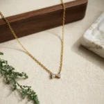 Graceful CZ Gold-Tone Bow Pendant