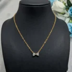 Graceful CZ Gold-Tone Bow Pendant