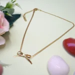 Minimal Gold-Tone Chain With Bow Accent