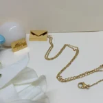 Graceful Gold-Tone Envelope Pendant