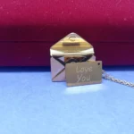 Graceful Gold-Tone Envelope Pendant