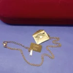 Graceful Gold-Tone Envelope Pendant